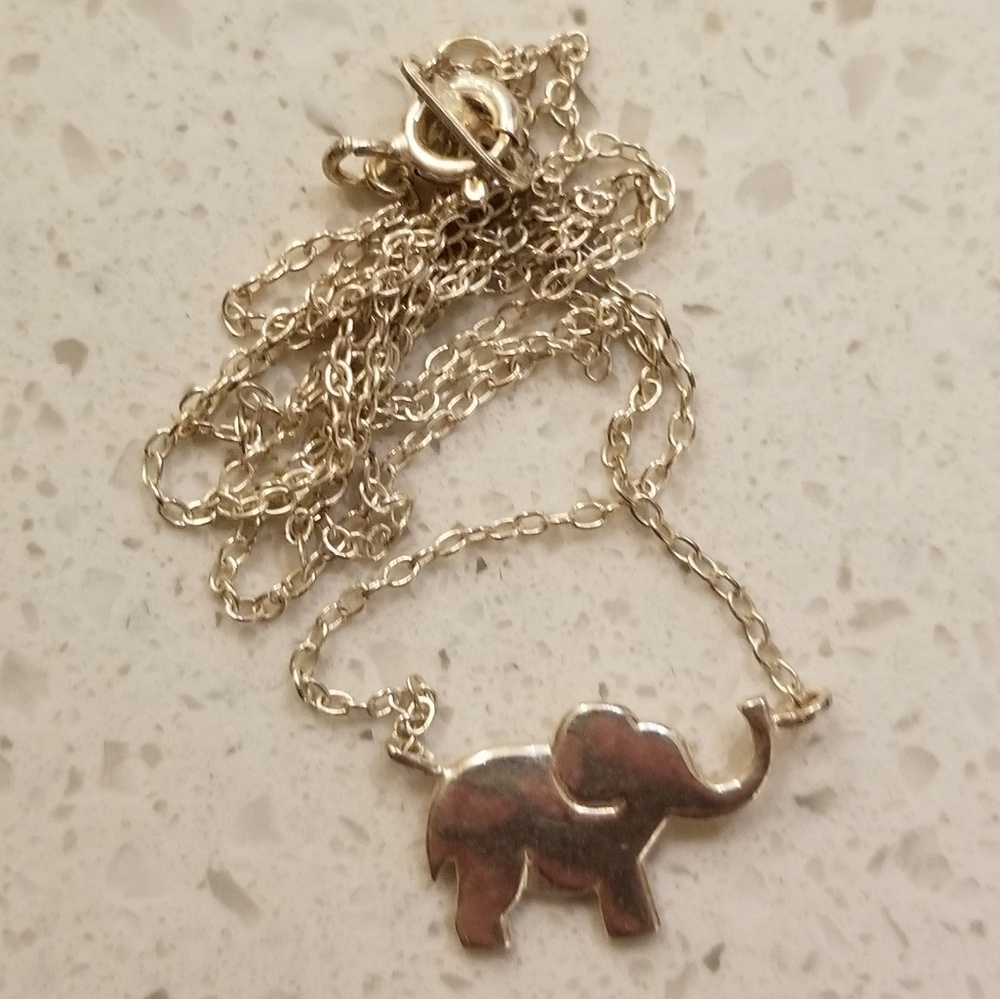Cute silver elephant necklace.